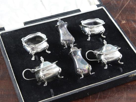 A cased 1930s six piece silver condiment set,